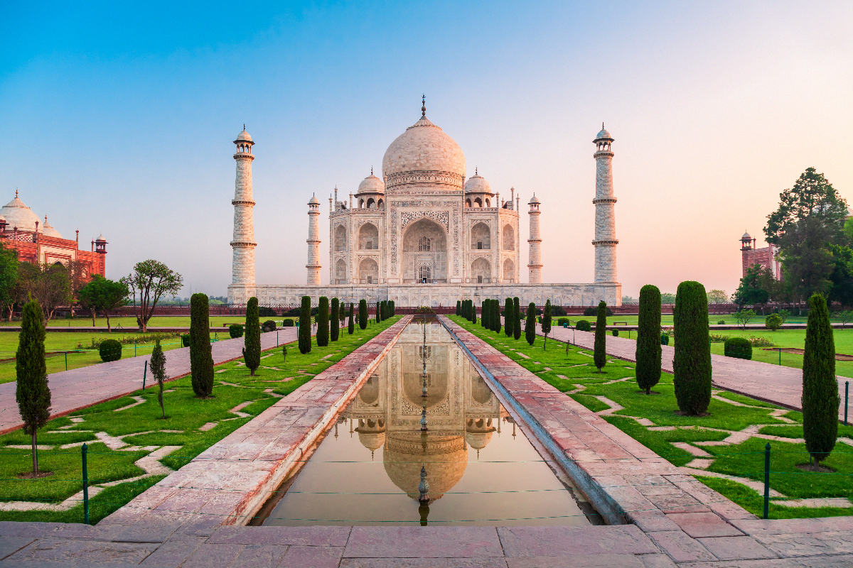 Taj Mahal is a white marble mausoleum on the bank of the Yamuna river in Agra city, Uttar Pradesh state, India