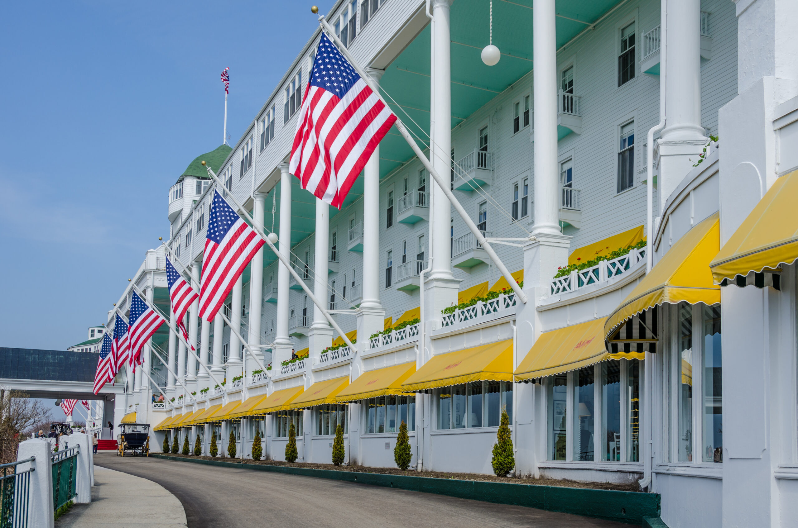Grand Hotel - Mackinac Island Michigan / American flags proudly hang in front of the Grand Hotel in Northern Michigan that has been welcoming guests since 1887.
