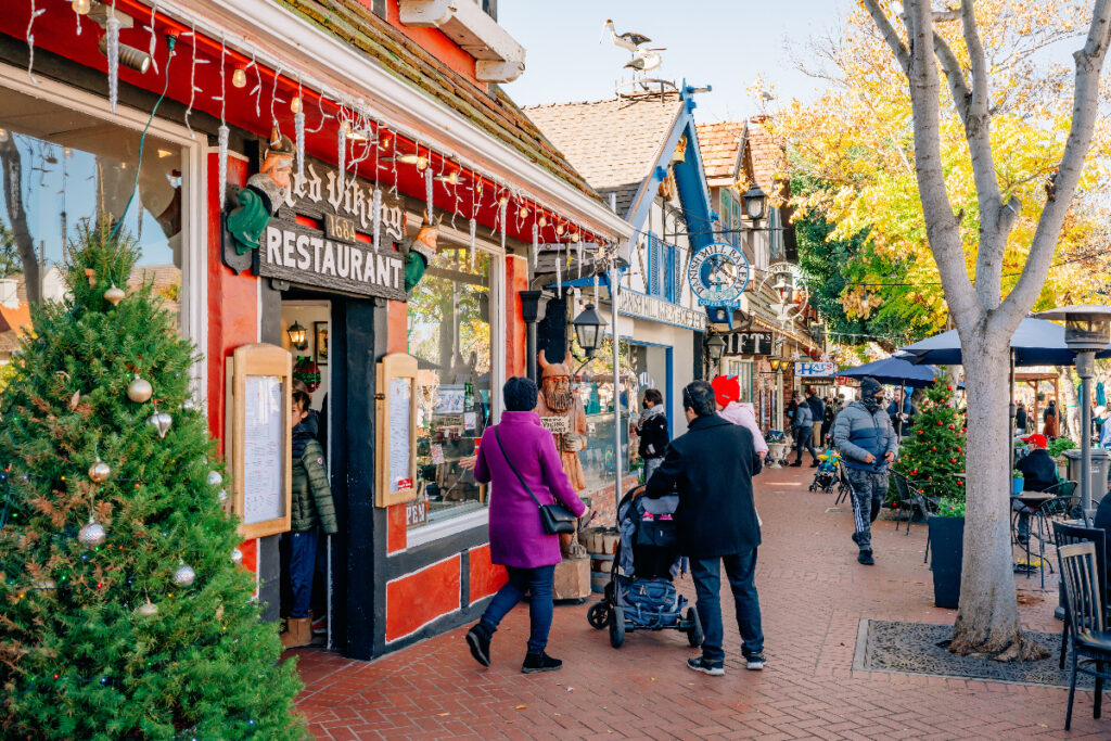 Solvang, California, USA - December 28, 2021 Christmas in Solvang. Main street, street view, and tourists in small city with traditional Danish style architecture, famous touristic destination