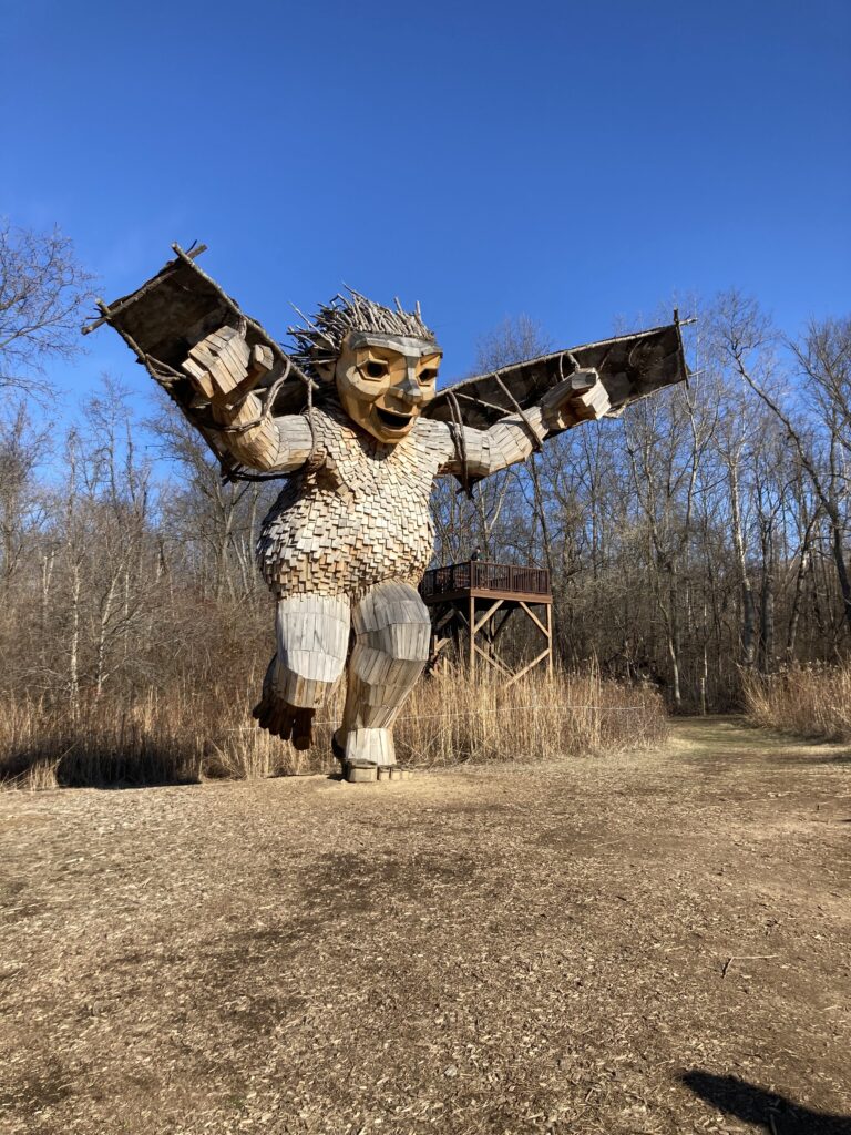 Fairborn, Ohio USA - Aullwood Audubon Center and Farm: A display of giant wooden troll statues graces the trails at Aullwood Audubon Center and Farm.